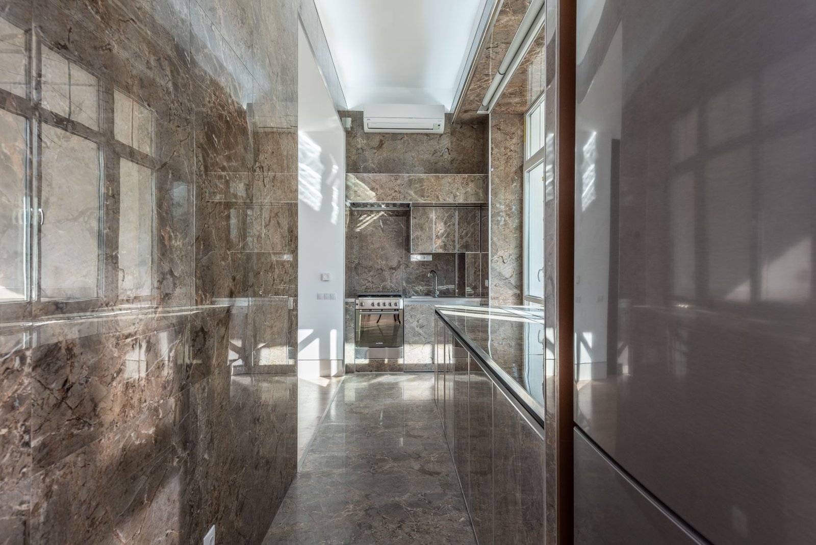 Interior finished with polished large-format marble surfaces